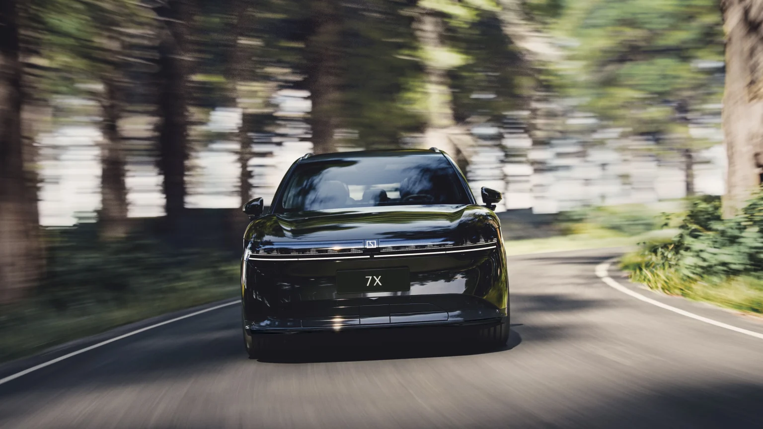 Zeekr 7X electric SUV on a tree-lined road